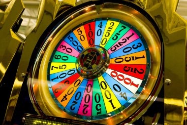 Mobile phone displaying live roulette table with dealer and betting interface
